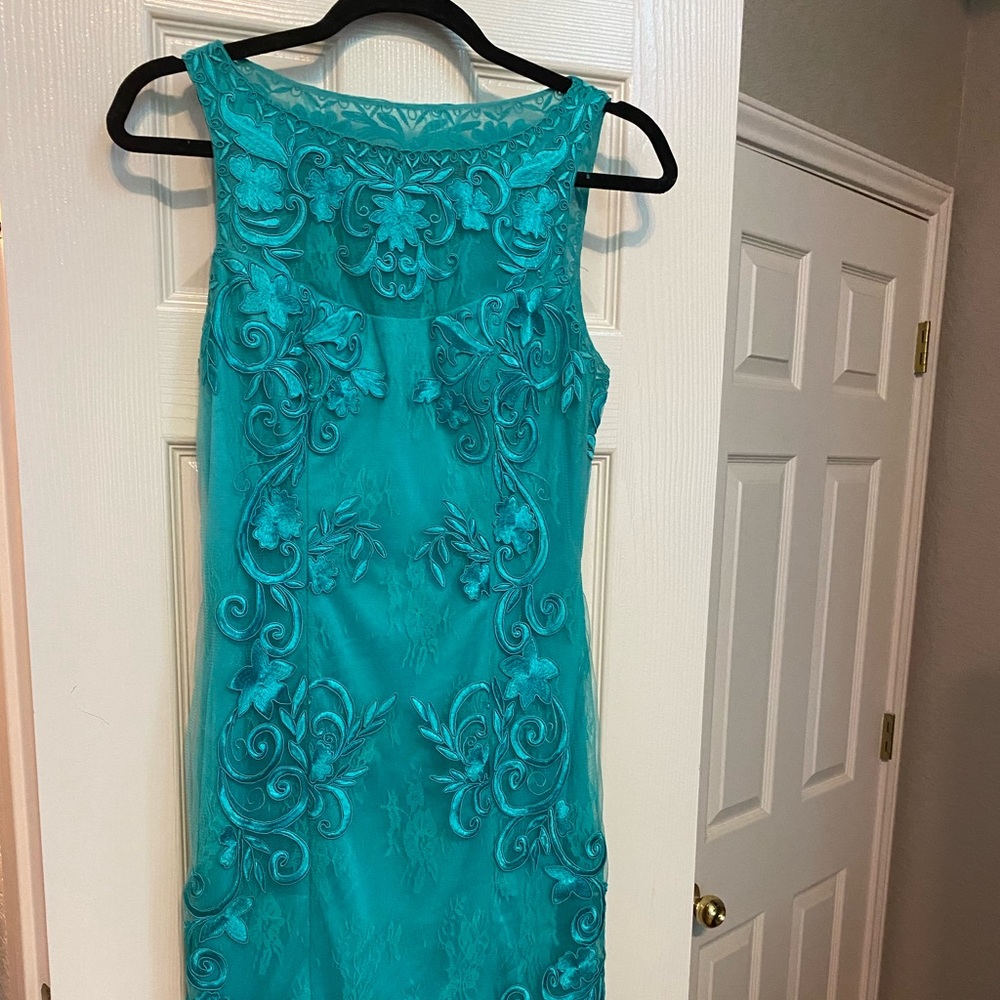 A pop of color and detail makes the perfect dress for your next event.